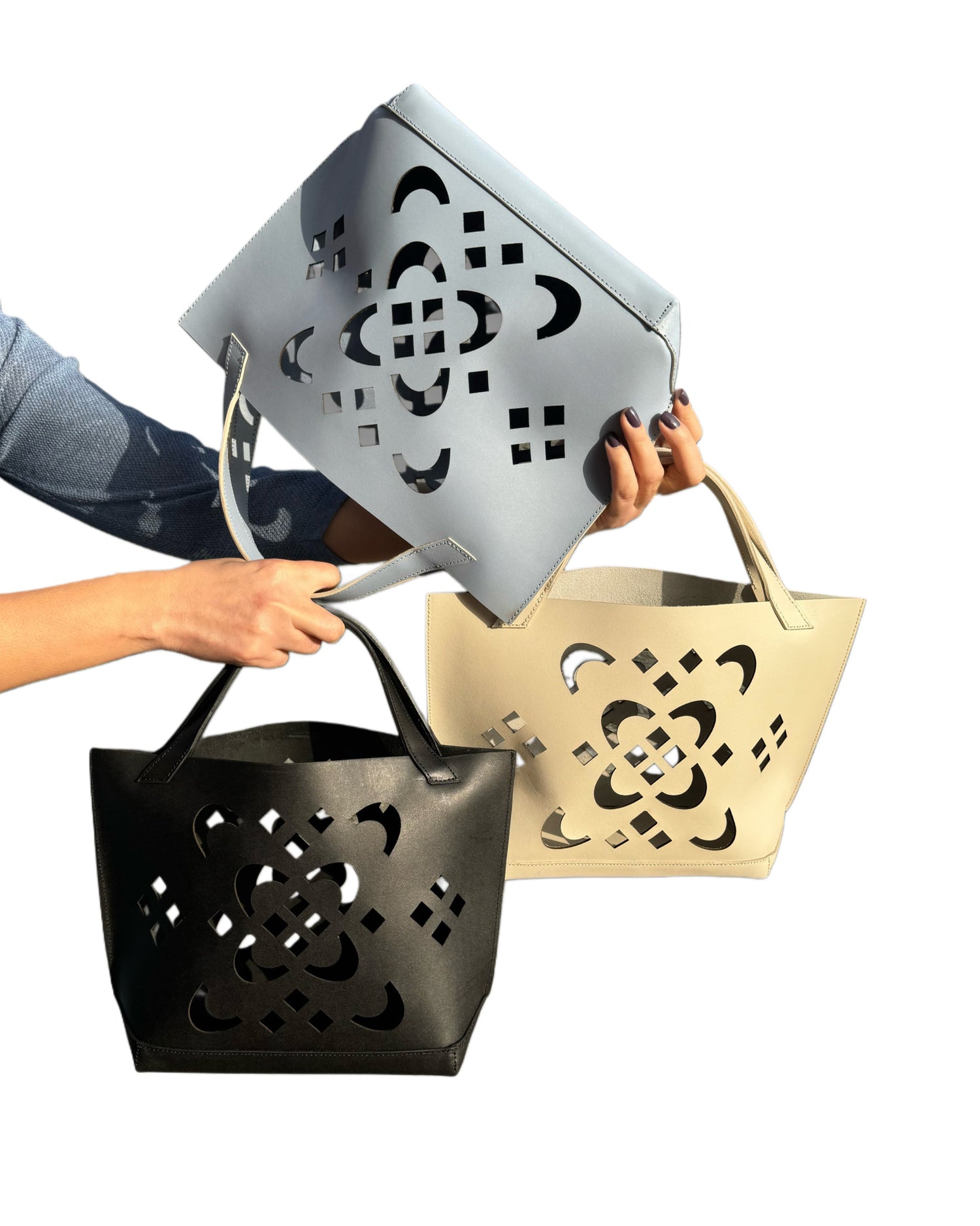 tote bag in genuine leather with laser cut logo flower motif