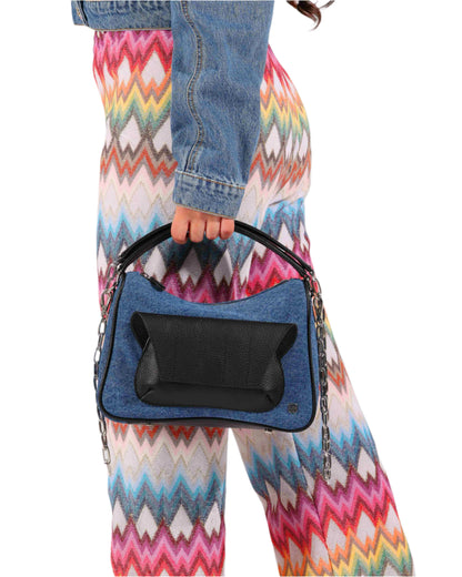 blue denim and black leather cross body bag with top handle and outer front pocket and zipper pocket in the back. fits all your essentials for everyday casual look