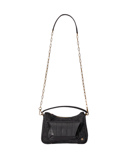 Black denim and leather cross body bag with top handle and outer front pocket and zipper pocket in the back. fits all your essentials for everyday casual look