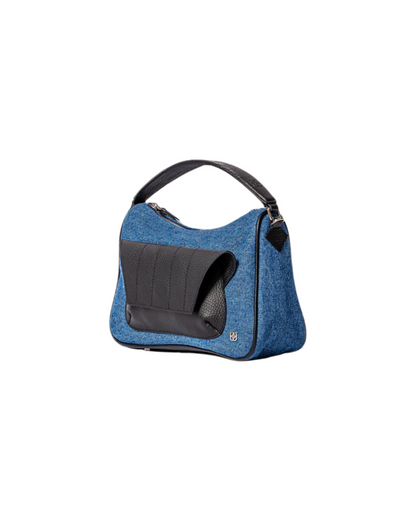 blue denim and black leather cross body bag with top handle and outer front pocket and zipper pocket in the back. fits all your essentials for everyday casual look